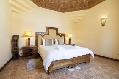 a bedroom with a large bed in a room at Quinta Dionysus in Albufeira