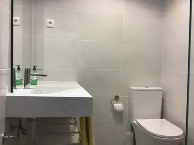 a bathroom with a sink and a toilet at Marina View Apartment in Albufeira