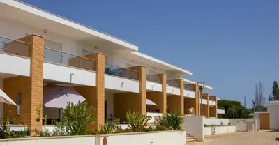 an external view of a building with balconies at Sul House in Albufeira