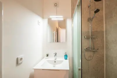 a bathroom with a sink and a shower at BeGuest Oceanic Rainbow Apt in Albufeira