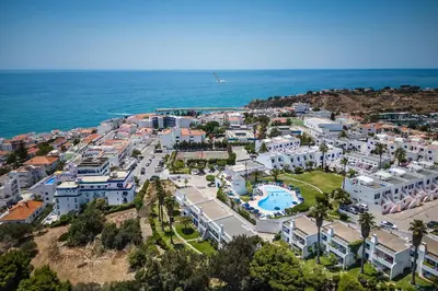 an aerial view of a resort near the ocean at Vista Portuguesa by OCvillas in Albufeira