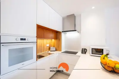 a bedroom with a bed and a large window at #087 T1 Vale Mangude 308 by Home Holidays in Albufeira