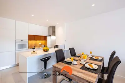 a kitchen and dining room with a table and chairs at #087 T1 Vale Mangude 308 by Home Holidays in Albufeira