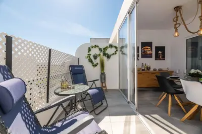 a balcony with a table and chairs on a balcony at Salgados 2-Bedroom Apartment - 900m from the Beach - Wifi in Guia