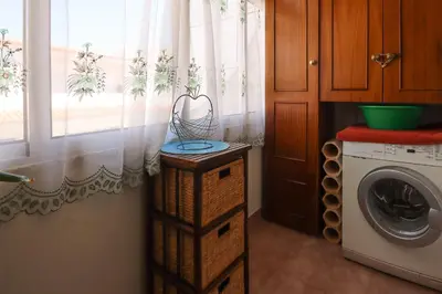 a laundry room with a washing machine and a washer at Apartamento Pateo - Algarve - BY BEDZY in Albufeira