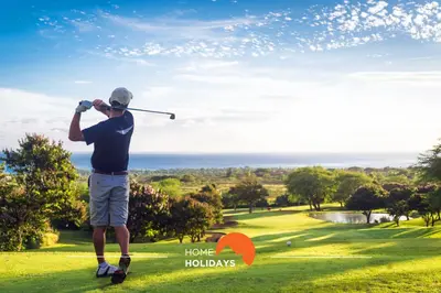 a man is playing golf on a golf course at #096 Casa Antonieta 1 by Home Holidays in Albufeira