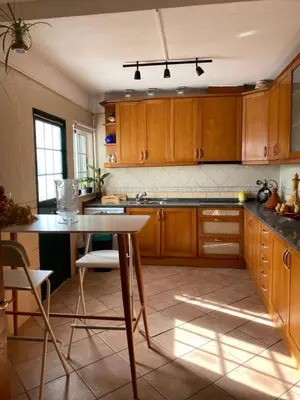 a bedroom with a large bed and a large window at Moradia a 5 minutos da PRAIA in Albufeira