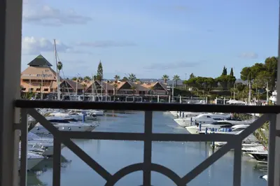 a view from a balcony of a marina with boats at Marina Plaza, Vilamoura in Vilamoura