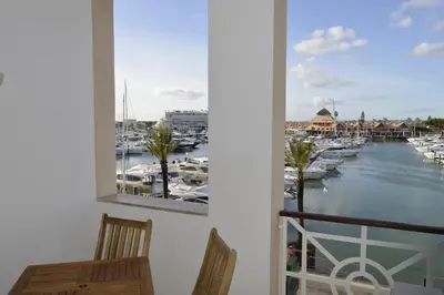 a balcony with a view of a marina at Marina Plaza, Vilamoura in Vilamoura