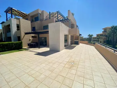 a large patio in front of a building at Janelas do Oceano - Casa de Ferias T3 Vilamoura in Vilamoura