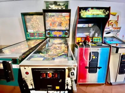 two arcade machines sitting next to each other at Fresh and cosy appt with Pool, Fiber, LargeTV, Gaming Room in Albufeira