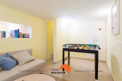 a room with a couch and a table with a bed at #086 Fish House by Home Holidays in Albufeira