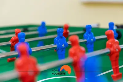 a group of blue and red figures on a pool table at #086 Fish House by Home Holidays in Albufeira
