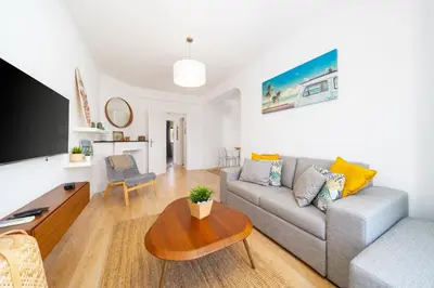 a living room with a couch and a table at AL - Apartamento Sol Nascente 1 Top Floor in Quarteira