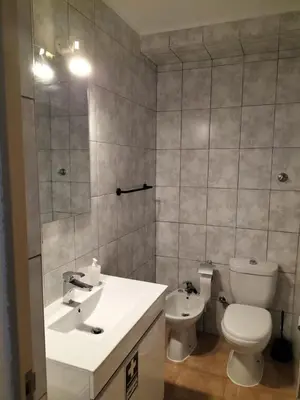 a bathroom with a toilet and a sink at Apartamento Maria do Céu Villa Magna in Albufeira