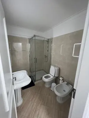 a bathroom with a toilet and a shower and a sink at Relaxing 2 Bedroom House 5 minutes away from Vilamoura Marina in Quarteira
