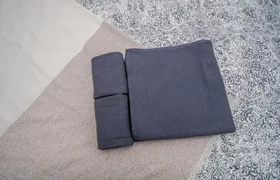 a pair of black napkins sitting on a rug at Charming Private Rooms in an Apartment A2 Penha - Faro in Faro