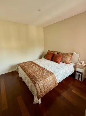a bedroom with a bed with two towels on it at Victoria Gardens Luxury Apartment by PA Hotels in Quarteira