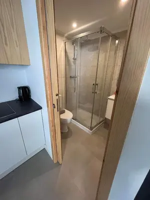 a bathroom with a shower and a toilet at CASA DAS MOURAS in Faro