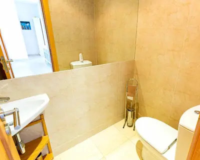 a bathroom with a toilet and a sink at Marina Vilamoura Aquamar 304 By Vilamoura Sun in Vilamoura