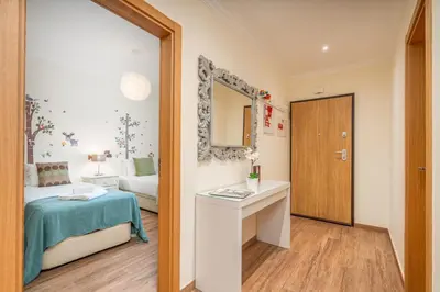 a small room with a bed and a mirror at #010 Marina by Home Holidays in Albufeira