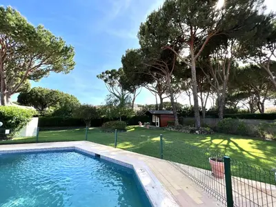 a swimming pool in a yard with trees at Vila Santo Antonio - Vilamoura by HD PROPERTIES in Vilamoura