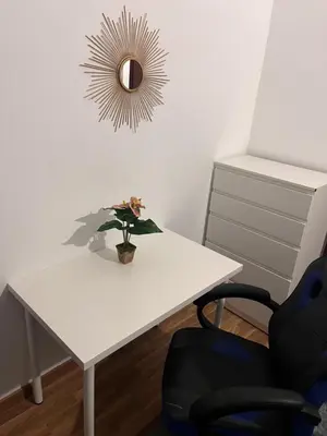 a white table with a potted plant and a mirror at Casa Amarela in Loulé