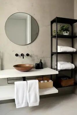 a bathroom with a sink and a mirror and towels at Arty Casa in Faro