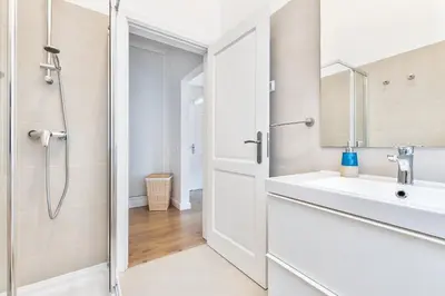 a bathroom with a sink and a shower at Villa Isabella by OCvillas in Paderne