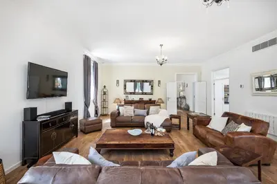 a living room with a couch and a table at Villa Isabella by OCvillas in Paderne