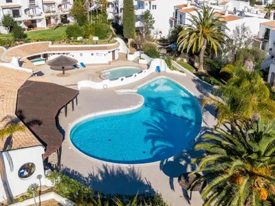 an overhead view of a swimming pool in a resort at Apartment São Rafael 63 - Beach - Pool - Free wi-fi - Air Con in Albufeira