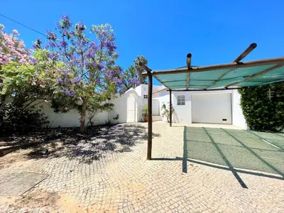 a pavilion in front of a building with a garage at Albufeira Balaia Villa With Private Pool by Homing in Albufeira