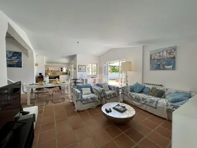 a living room with two couches and a table at Albufeira Balaia Villa With Private Pool by Homing in Albufeira