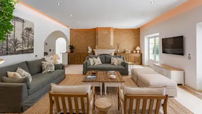 a living room with a couch and a table at Portuguese mansion close to marina, golf and beach. in Vilamoura