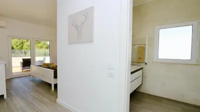 a white room with a desk and a window at Vila Renascer-CleverDetails, few minutes from the center, quiet area in Vilamoura
