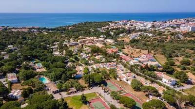 an aerial view of a neighborhood with houses and the ocean at Sea 3BDR House W/ Patio by Lovelystay in Albufeira