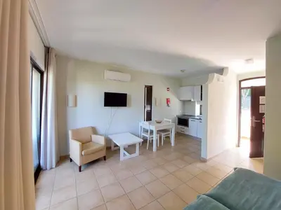 a living room with a couch and a table at A CASA da PRAIA ALBUFEIRA PORTUGAL in Albufeira