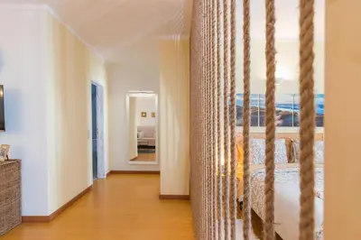 a bedroom with a bed with a view of the ocean at Downtown & Beach in Albufeira