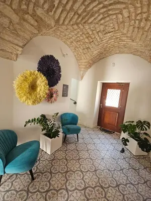 a lobby with chairs and a door with a ceiling at Eleven, Boutique luxury house & garden in Boliqueime