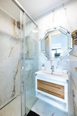 a bathroom with a sink and a mirror at Medusa Luxury Marina in Vilamoura