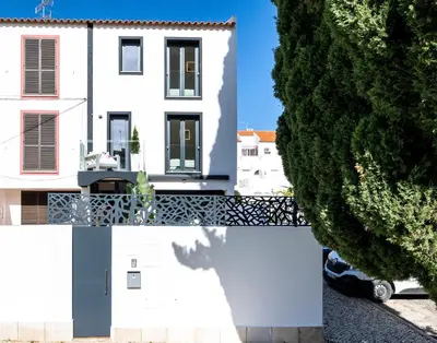 a white house with a tree in front of it at Medusa Luxury Marina in Vilamoura