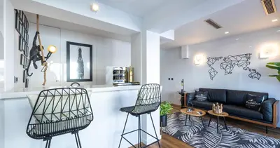 a living room with two chairs and a couch at Medusa Luxury Marina in Vilamoura