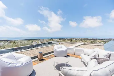a view of the ocean from the balcony of a house at Villa Luxueuse Vue Mer in Albufeira