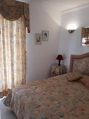 a bedroom with a bed and a window at Algarve Paraíso Casa Lagos e Relvas in Estói