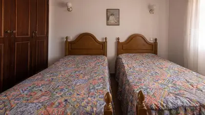 two beds sitting next to each other in a bedroom at Apartamento Tio Pedro - by bedzy in Albufeira