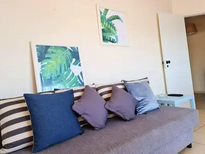a balcony with a washing machine and a window at Charming Vilamoura Apartment with Shared Pool in Vilamoura