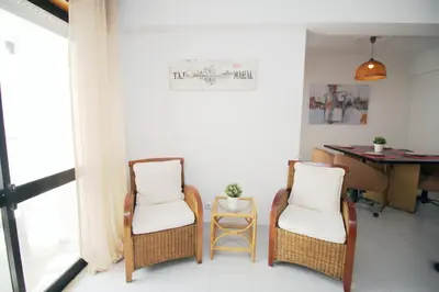 a living room with a couch and chairs and a window at A Santo, Quarteira - By Urbinvest Algarve in Quarteira