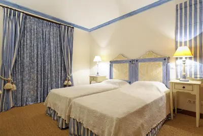 a hotel room with two beds and curtains at Tulio 2 Bedroom Luxury Apartment located in Encosta Do Lago in Quinta do Lago