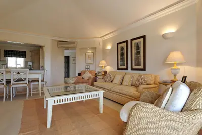 a living room with a couch and a table at Tulio 2 Bedroom Luxury Apartment located in Encosta Do Lago in Quinta do Lago