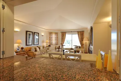 a living room filled with furniture and a large window at Tulio 2 Bedroom Luxury Apartment located in Encosta Do Lago in Quinta do Lago